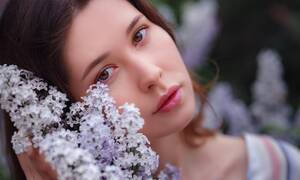 asian unclothed teens - Premium Photo | Beautiful young asian woman enjoying the blooming of  flowers lilac in spring. nude make up. close up portrait