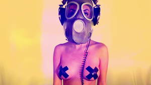 Gas Mask Girl Sexy - sexy woman with beautiful body dances with a gas mask covering her face.  Good clip