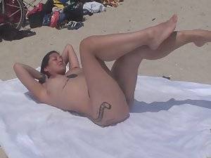 drunk naked beach crowd - Naked girl loves showing off tattoos