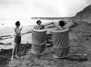 history - Women changing discreetly on a British beach, 1929