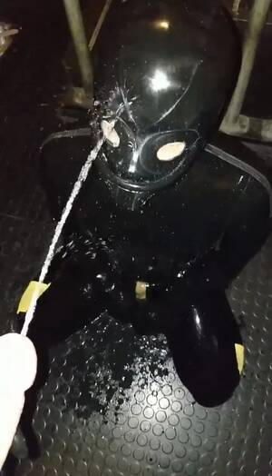 latex piss mask - Masked rubber gimp drinking master's piss - ThisVid.com