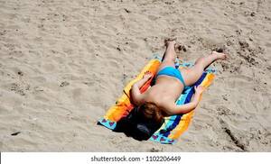 beach topless sunbathing videos - Girl Sunbathing On Beach Alicante Topless Foto de stock 1102206449 |  Shutterstock