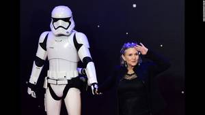 Carrie Fisher Profiles 8 Porn - Fisher salutes as she poses with a storm trooper at the European premiere  of "