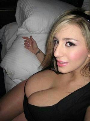 free on face n tits - Sexy blonde posing for the camera with her big boobs.