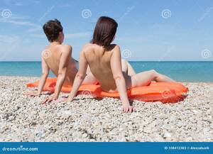 beach girls sunbathing topless - Two Women Sunbathing on Pebble Beach Stock Image - Image of girls, naked:  108412383