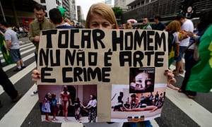 journalist in brazil nude beach - Protesters outside SÃ£o Paulo's Museum of Modern Art with placards showing  Wagner Schwartz's La BÃªte,