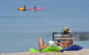 ethnic nudist on the beach - 913 Ballermann Stock Photos, High-Res Pictures, and Images - Getty Images