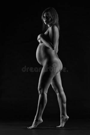 black and white nudes pregnant - Download Beautiful Naked Pregnant Woman On Black Studio Background,  Pregnancy Nude Concept Stock Image -