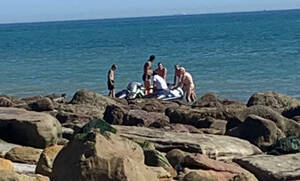 naked beach stripping - Boat full of migrants lands on nudist beach - and naked sunbathers offer  them hot drinks | The US Sun