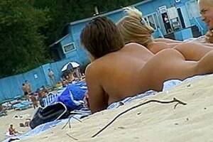 beach taking sun bath - Beach voyeur porn featuring two hot girls and a guy sunbathing naked