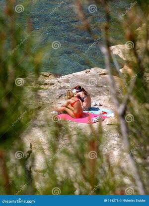 barefoot beach girls voyeur - Two Young Girls Sunbathing on Rocks by the Sea Stock Photo - Image of  tanned, voyeur: 134278
