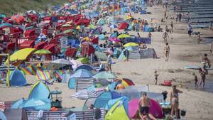 crowded nude beach sex - No Sex On The Beach: Netherlands Town To Sunbathers - Oneindia News