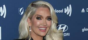 chris erika - Erika Jayne Covers Bare Chest With Nothing But Her Hands