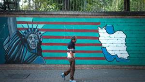 Hd Tiny Teen Huge Cock - A man in front of an anti-U.S. mural featuring the Statue of Liberty,