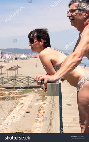 nude beach clip art - Middle Aged Couple Relaxing On Beach Stock Photo 269329892 | Shutterstock