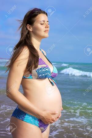 free nude beach nudist - Beautiful Pregnant Female Model Relaxing In Front Of The Sea Stock Photo,  Picture and Royalty Free Image. Image 14461729.