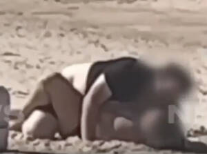 australian beach sex - Couple confronted after having sex on packed public beach