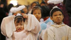 Chinese Toddler Girls Porn - Children dressed as angels attend a Christmas mass at a Catholic church in  Beijing.