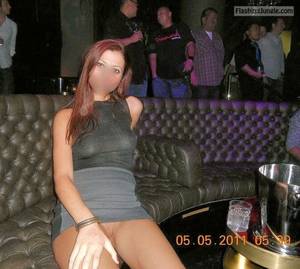 nightclub upskirt - Pantyless redhead in night club separe